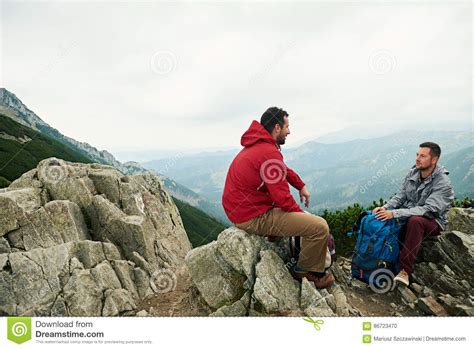 Hikers Talking Together On A Mountain Peak Stock Photo Image Of Hike