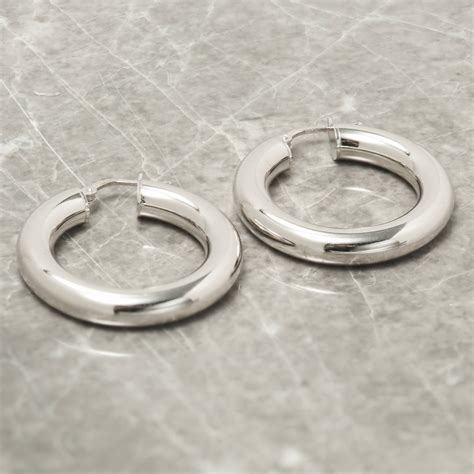Thick Hoop Earrings In Gold Or Silver By Loel And Co