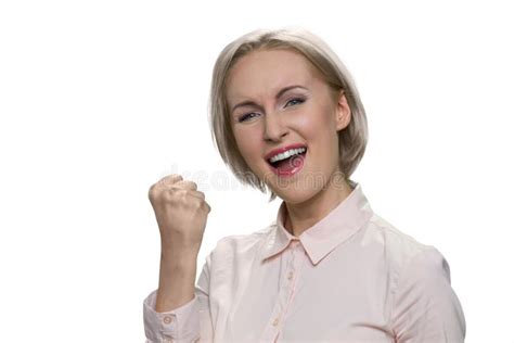 Excited Woman Standing And Make Yes Gesture By One Hand Stock Photo