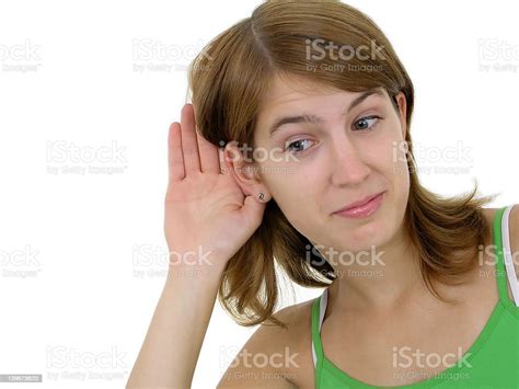 Woman With Hand To Ear Listening Stock Photo Download Image Now
