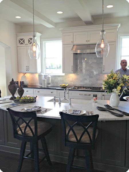 Here, the white island offers a clean and subtle departure from wood. Home tours part 1 from Thrifty Decor Chick