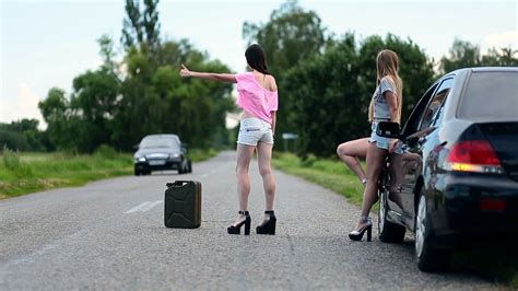 Young Women Hitchhiking Near Broken Car Stock Video Footage Storyblocks
