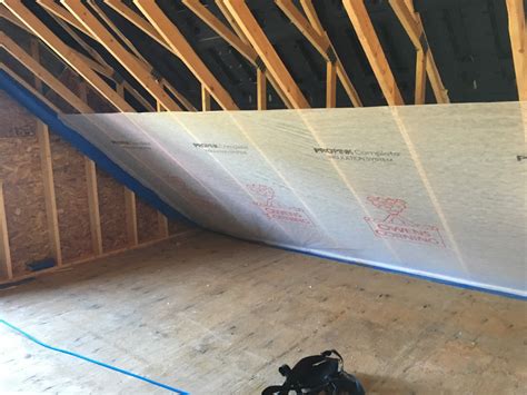 Find out which way the vapor barrier and the insulation would lay to prevent moisture tom: Garage Attic gets a Thick Winter Coat.