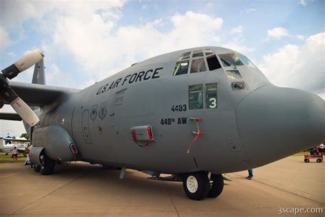 Aircraft weighs around 90,000 pounds and it is 100 feet long. C-130 Hercules transport aircraft Photograph by Adam Romanowicz