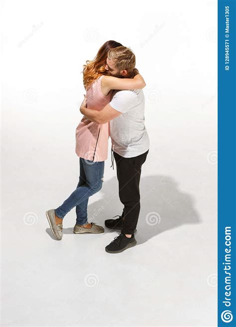 Full Body Portrait Of Hugging Couple With Smile Caucasian Models In