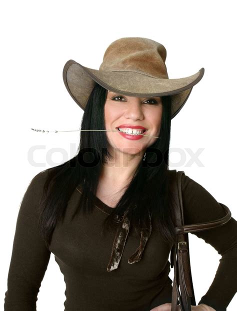 Smiling Cowgirl Wearing A Leather Western Hat And Carrying Bridle Stock Image Colourbox