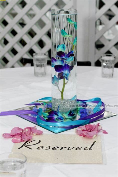 Blue Orchid Centerpiece On Each Table At The Reception Wedding