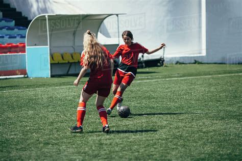 Determined Teenagers Playing Soccer On Field Stock Photo Dissolve