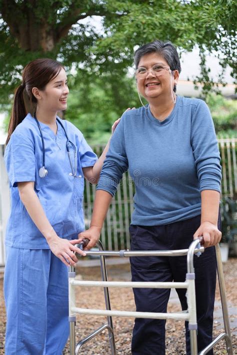 A Nurse Was Caring For The Elderly At Home Stock Photo Image Of