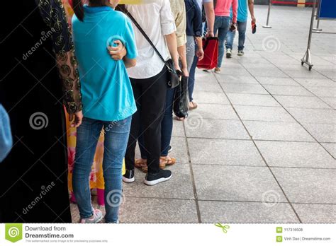 Queue Of Asian People Wait In Line In Urban Street Editorial Stock