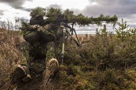 A Canadian Sniper Doing Reconnaissance During A Large Scale Training