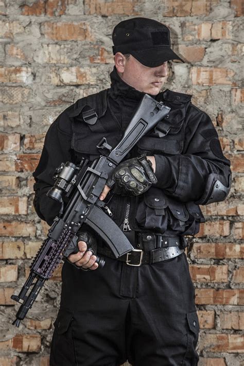Special Forces Operator In Black Uniform And Bulletproof Vest Poster