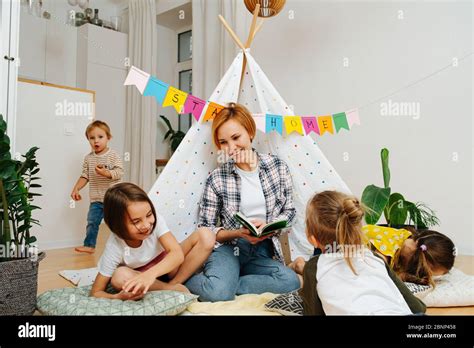 Woman Reading Bedtime Story Children Hi Res Stock Photography And