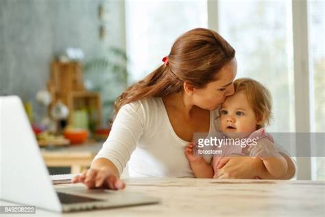 Sitting On Lap Kissing Photos Et Images De Collection Getty Images