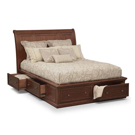 However, with creative placement and a minimalistic approach to other bedroom furniture, you can 2 women putting up shelves on wall. Hanover Queen Storage Bed - Cherry | American Signature ...