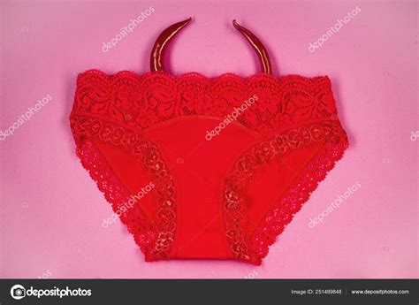 Concept Of Erotic Clothing Panties And Peppers On A Pink Backgr Stock