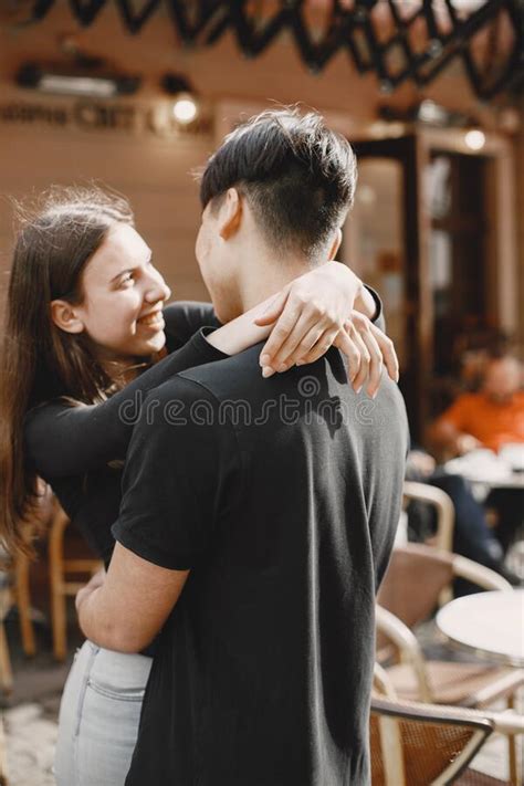 Two Lovers Hug On The Streets Of The Old City During A Date Stock Image