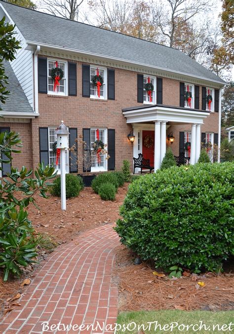 Cup hooks can be screwed into wood or brick which makes it convenient to hang outdoor christmas garlands. Easy Way To Hang Wreaths on Exterior Windows