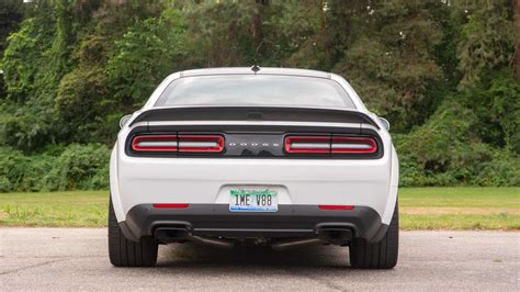 Two Dodge Challenger Hellcats Outrun Police Charger At Drag Strip