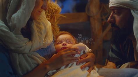 Mary And Joseph Admiring Sleeping Baby Jesus Stock Photo Image Of