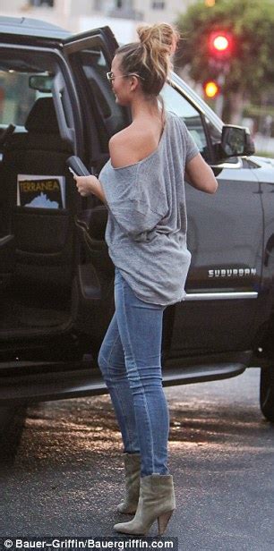 Chrissy Teigen Wears Slinky Top And Skinny Jeans In Beverly Hills