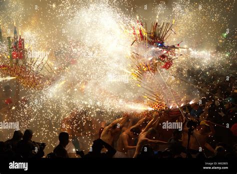 Chinese Entertainers Perform A Dragon Dance In Sparks Of Fireworks To