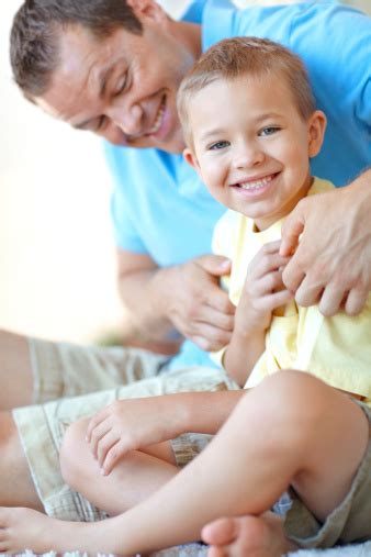 Getting Tickled By Dad Stock Photo Download Image Now 30 39 Years