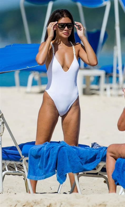 montana brown dons her sexy white swimsuit on the golden sandy beaches of barbados 32 photos