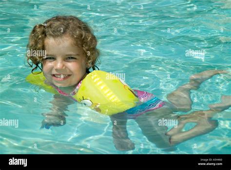 Little Girl Swimming In A Pool Stock Photo Alamy