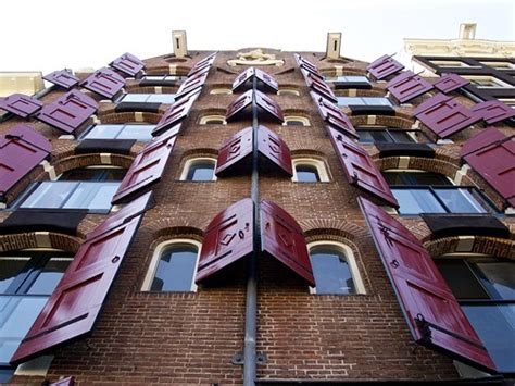 Symmetry Symmetric Windows Of A Brick Building In Amsterda