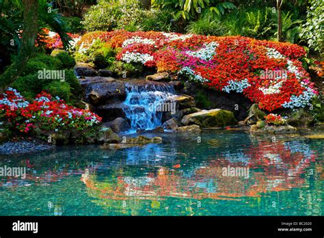 A Beautiful Flower Garden With A Waterfall In Tropical Souther Stock