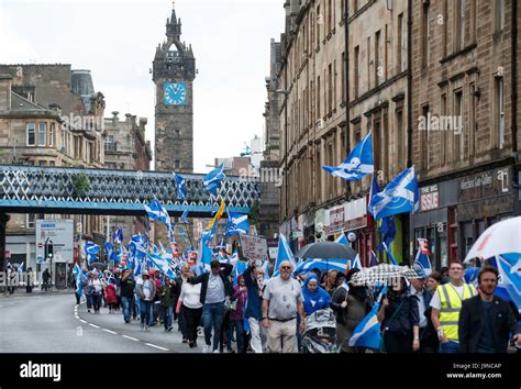 People Taking Part In The March For Independence Through Glasgow Wave