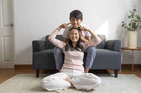 asian brother and sister hugging with care and love stock image image of ethnicity indoors