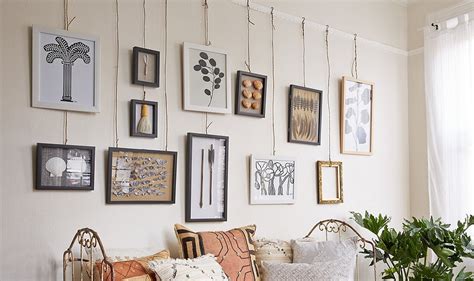 Picture hanging systems consist of rail, cords and hooks. Bend Me, Shape Me: 5 Unique Ways to Hang Artwork | Decorist
