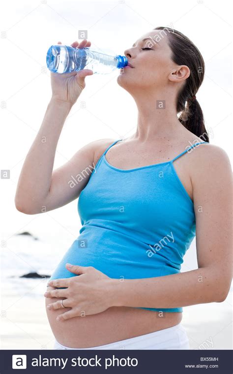 Pregnant Woman Drinking Water Stock Photo Alamy
