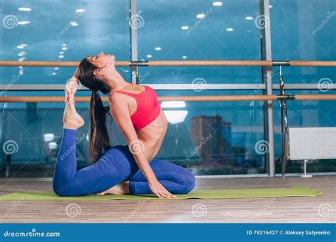 Young Woman Doing Yoga Exercises On Mat At Gym Stock Image Image Of Leisure Happy 79216427