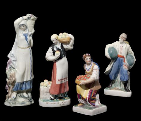 Three Soviet Porcelain Figures Of Peasants With Fruits And A Figure Of A Georgian Woman All