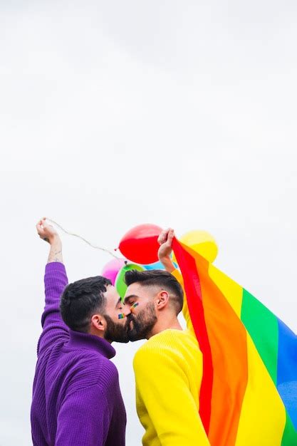 Free Photo Gay Sweethearts Kissing On Lgbt Pride Parade