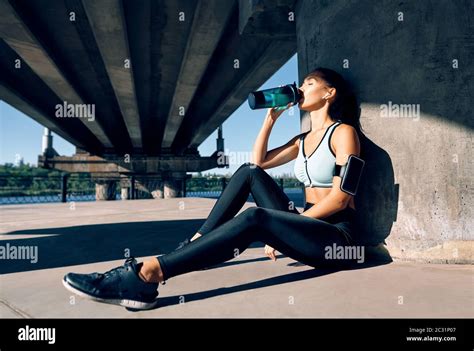 Young Fitness Woman Drinking Water From Bottle Stock Photo Alamy