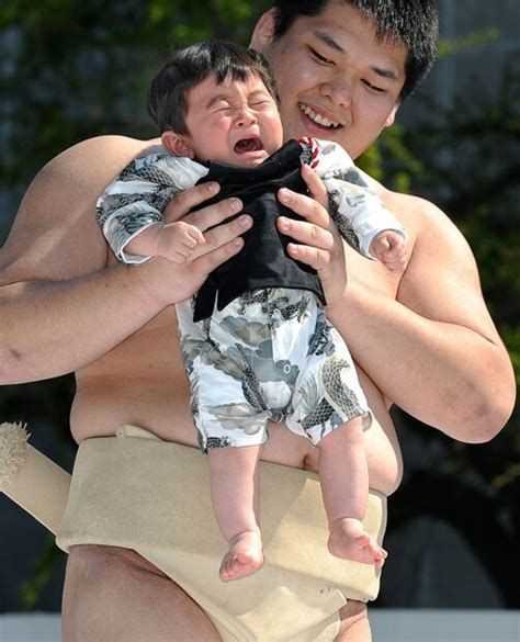 Sumo Wrestlers Make Babies Cry At The Naki Sumo Crying Baby Contest In Japan