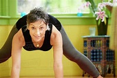 Older Caucasian woman practicing yoga - Stock Photo - Dissolve
