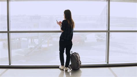 Young Girl Takes Selfie Photo Near Airport Window Happy European