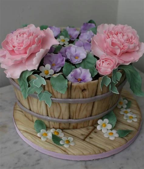 This bouquet is hand arranged by a local florist for a truly unique present. Flower pot cake | Flower pot cake, Pot cakes, Birthday ...