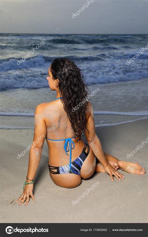 Woman In Bikini Siting By The Shore Stock Photo By Felixtm 173933002