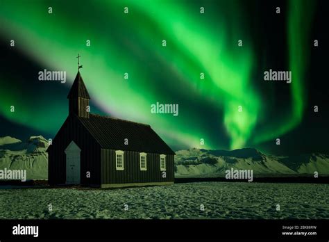 Northern Lights Over A Small Black Church Aurora Borealis Over One Of