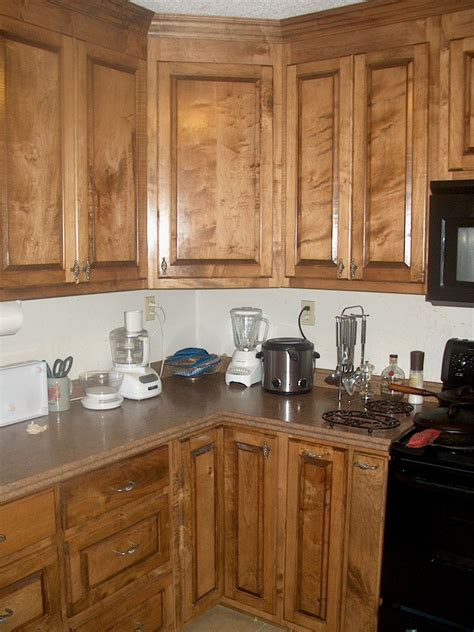 I practically have to crawl in them to get out the occasionally used cake plate or meat platter. Kitchen Corner Cabinet with Clever Storage Systems Inside - Amaza Design