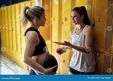 Sporty Women Talking In Locker Room Before Basketball Training Stock