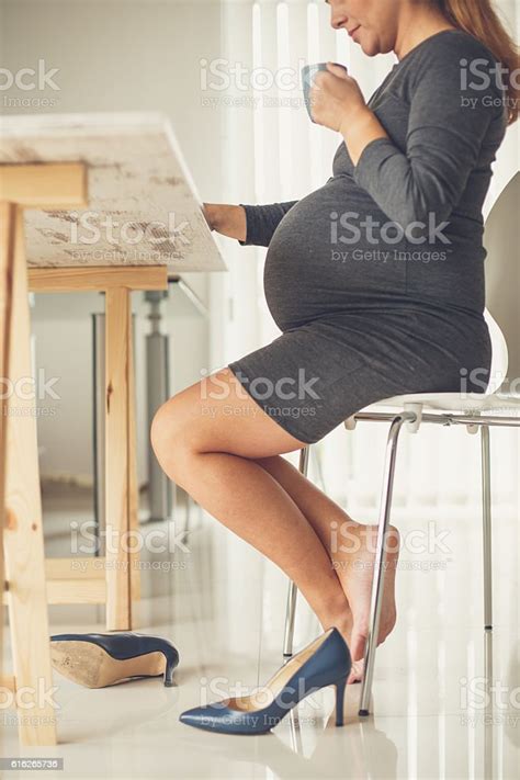 Barefoot Pregnant Business Woman In Office Drinking Coffee Stock Photo