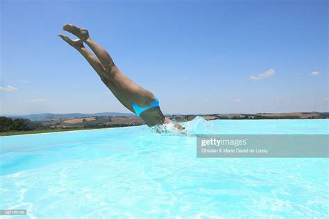 Mid Adult Woman Diving Into Swimming Pool Photo Getty Images