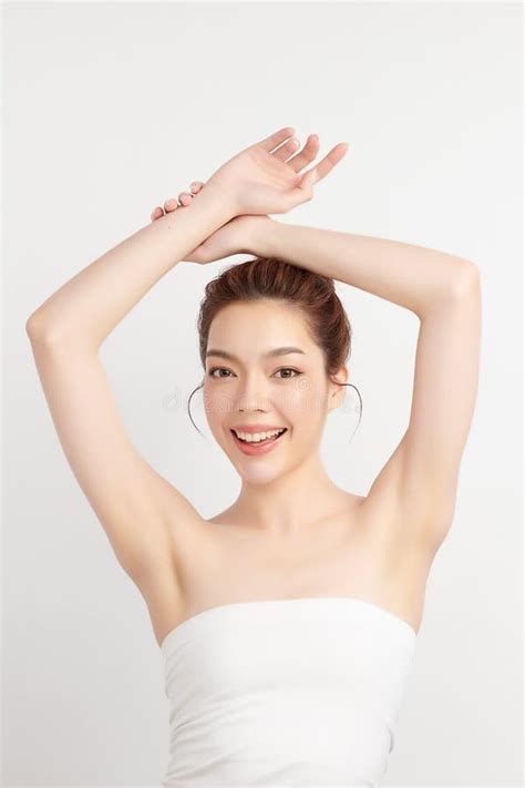 Beautiful Young Asian Woman Lifting Hands Up To Show Off Clean And